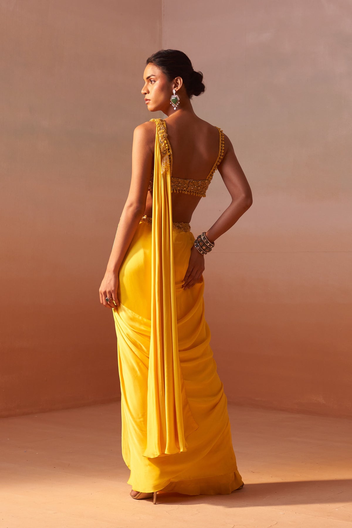 Yellow Draped Saree With Nude Choli