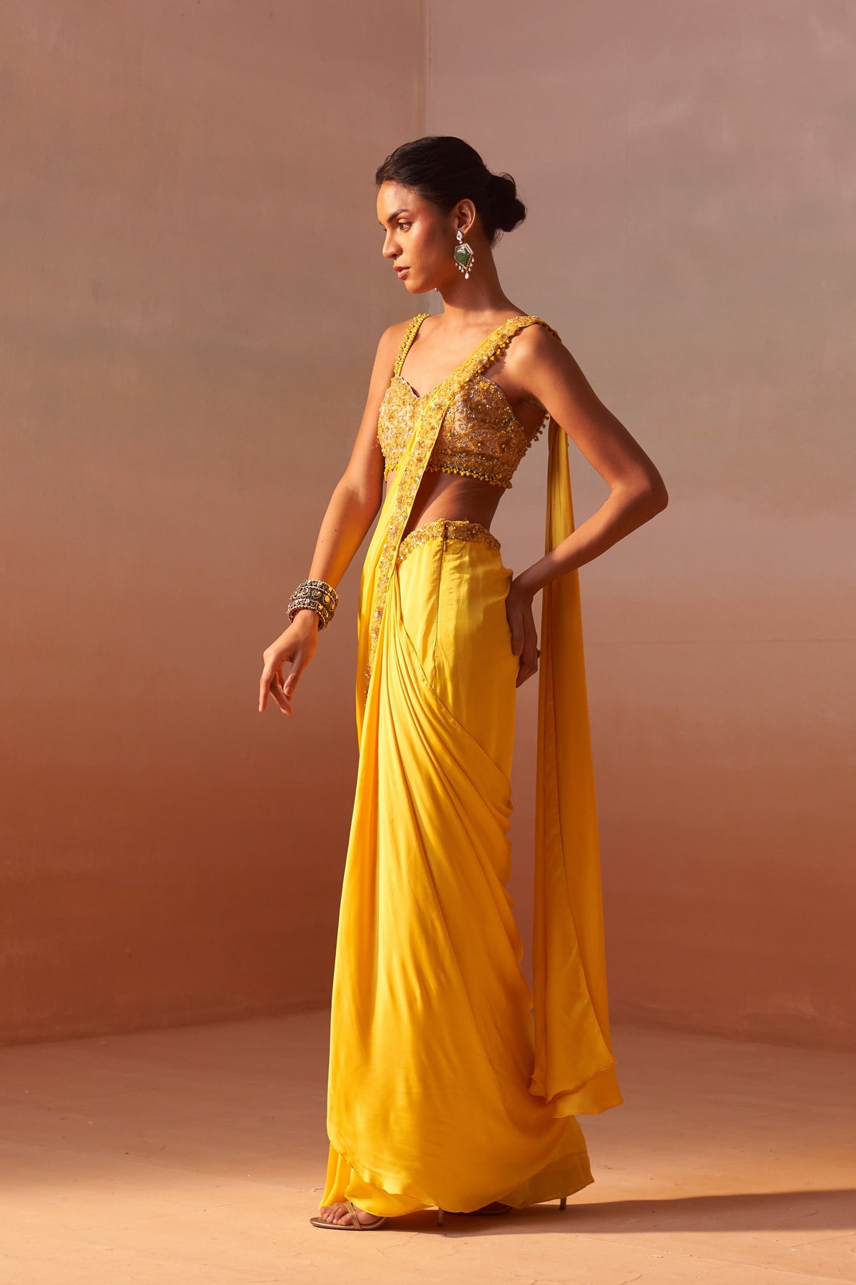 Yellow Draped Saree With Nude Choli