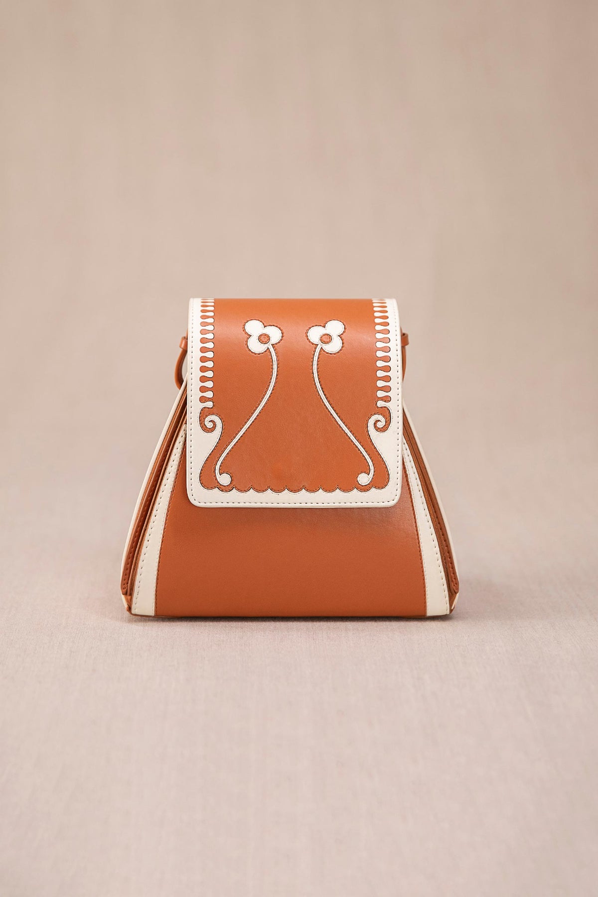 Tan and ivory marhum bucket bag