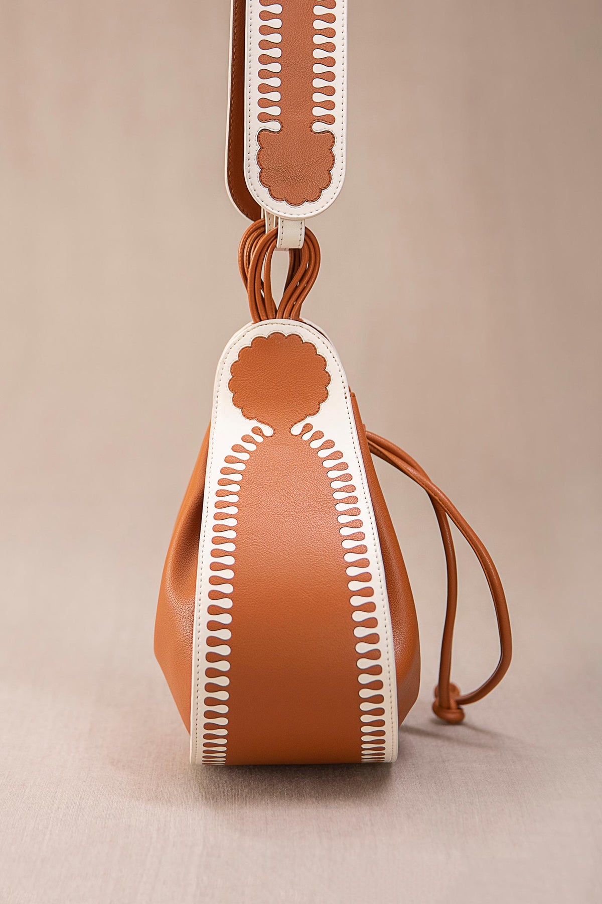 Tan and ivory nusrat bucket bag