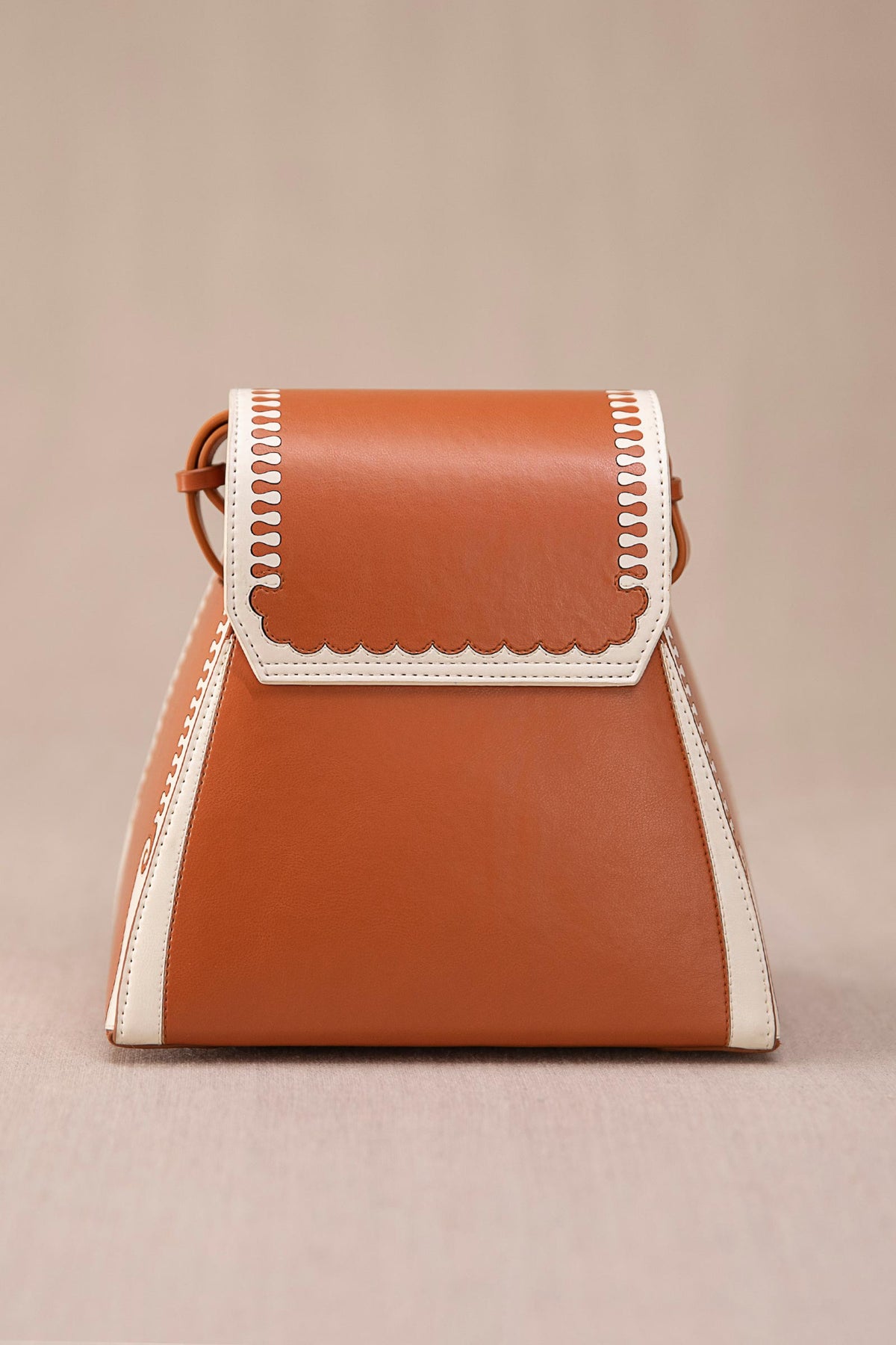 Tan and ivory marhum bucket bag