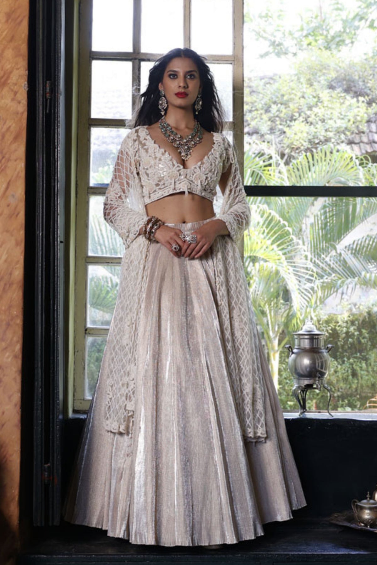 Ivory Pan Neck Cap Sleeves Choli with Ivory Pleated Lehenga Skirt with Net Dupatta