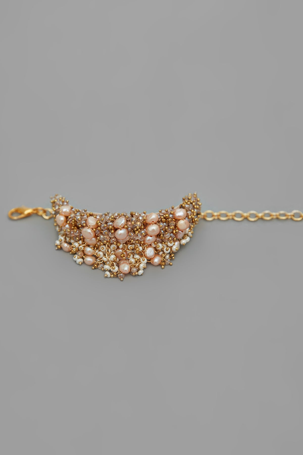 Peach Pearl Studded Bracelet With Gold Beads