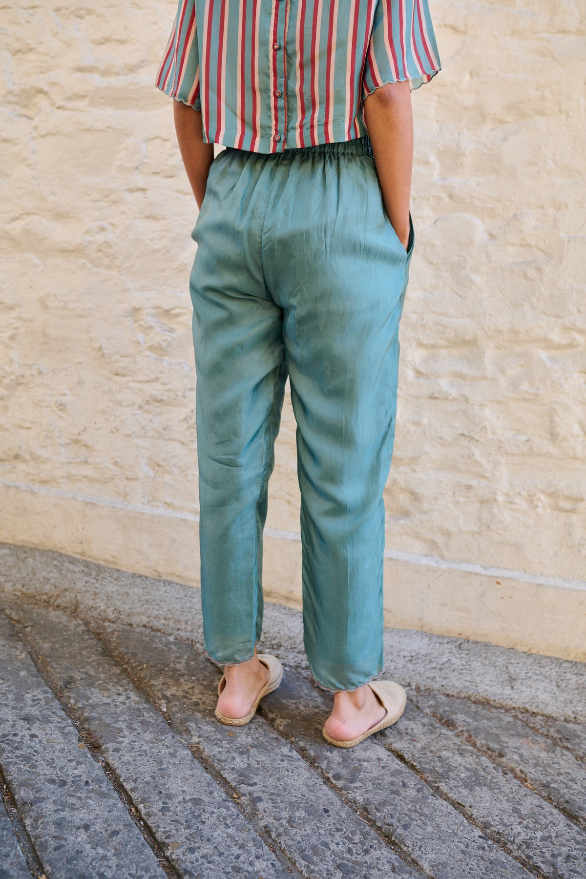 Pull on striper trousers with pockets and scalloped hem