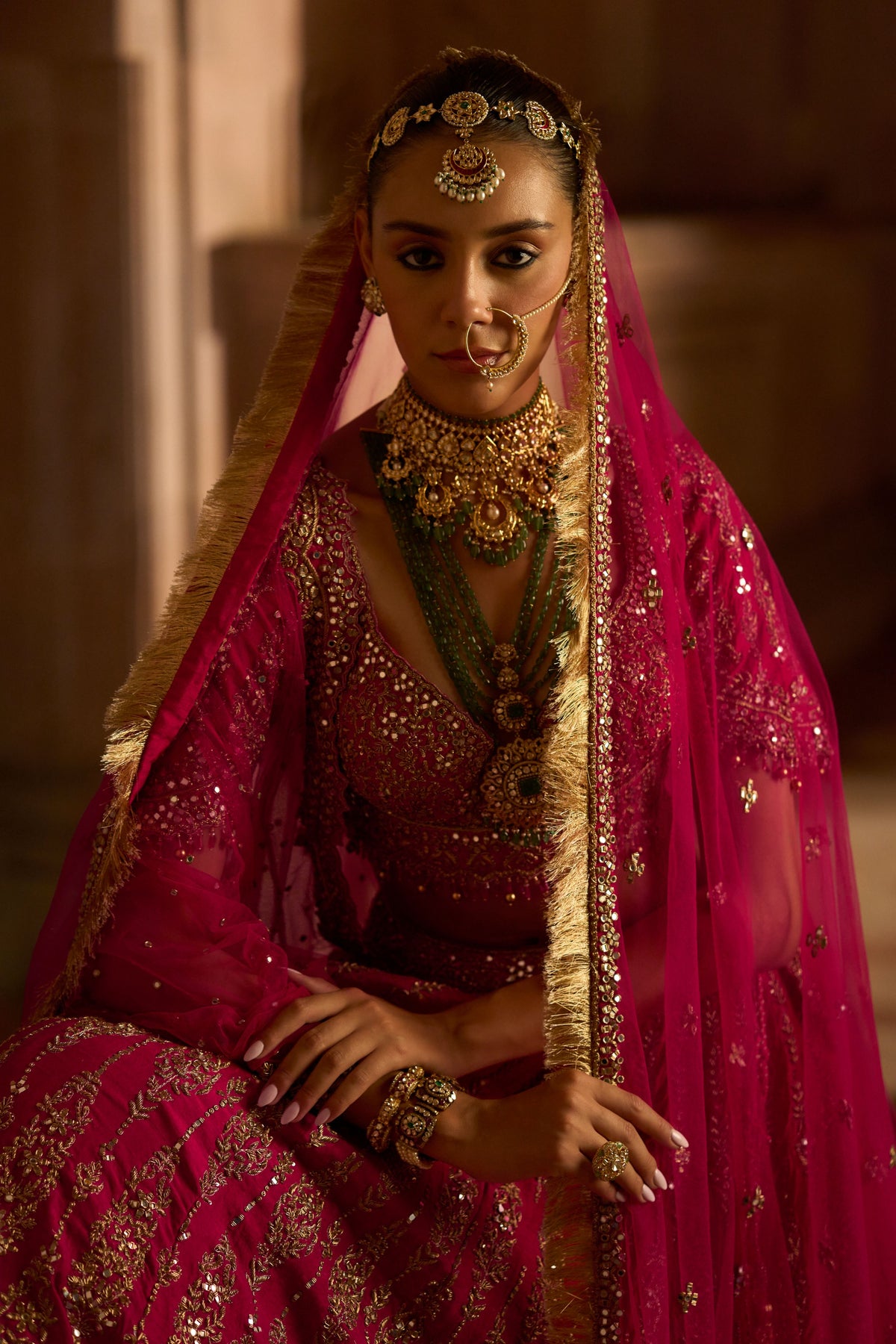 Photo of Red bridal lehenga with green jewellery | Indian bridal dress,  Indian bridal outfits, Indian bridal lehenga